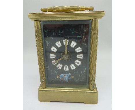 A brass four glass sided carriage clock with enamel dial, rear glass panel a/f