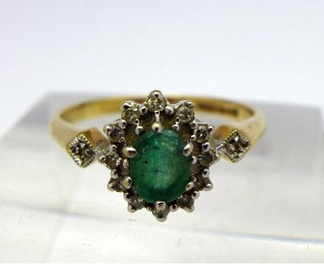 A 9ct gold, diamond and emerald ring, weight 2g, size M