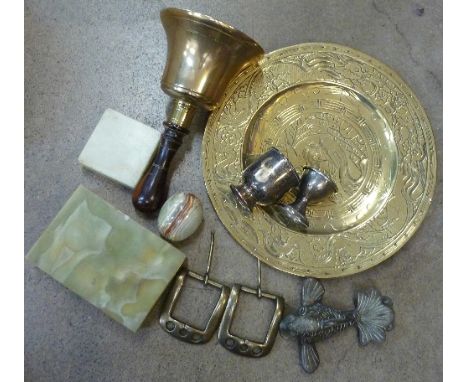 An oriental brass charger, a brass bell, a door knocker, an onyx box, etc.