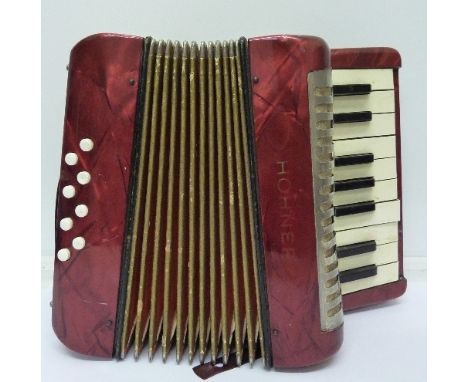 A small Hohner eight button accordion