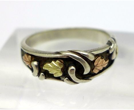 A white and yellow metal ring, size K