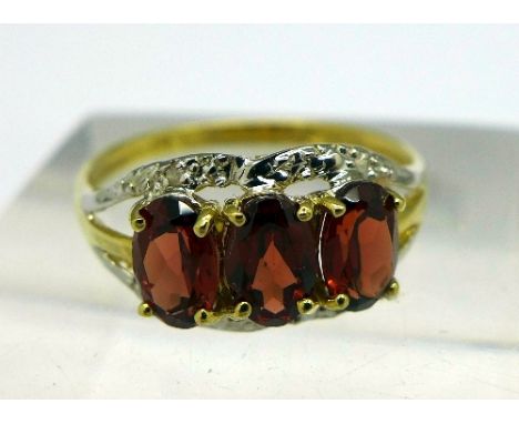 A 9ct gold, garnet and diamond ring, weight 1.5g, size O