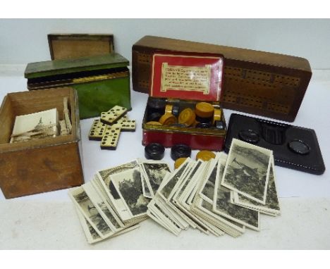 A collection of photographic cards, a viewer, dominoes, checkers, playing cards, etc.