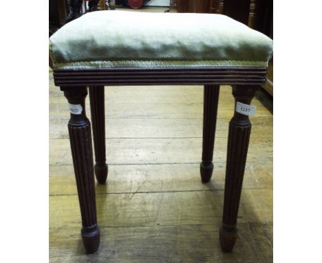 A mahogany stool, on tapering reeded legs