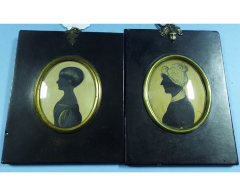 An oval bust portrait miniature, of a young girl, 6 x 5 cm, and another similar (2)