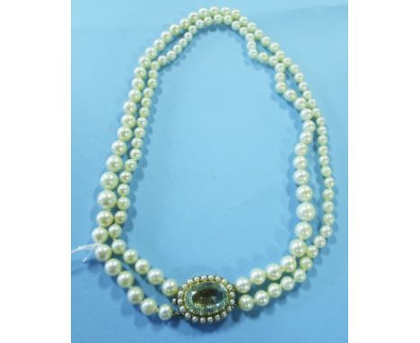 A two strand pearl necklace, with a large oval aquamarine and pearl clasp