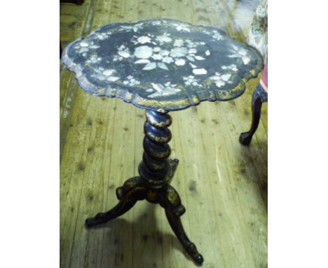 A Victorian black lacquer and papier mâché tripod table, with mother of pearl and gilt decoration, 50 cm wide