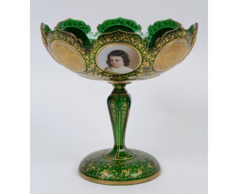 A Bohemian green and white cased glass comport, painted four portrait roundels of children, and with gilt decoration, 20 cm h