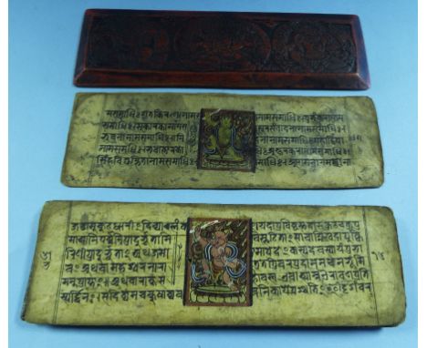 A Nepalese palm leaf manuscript, painted deities, with two wooden covers