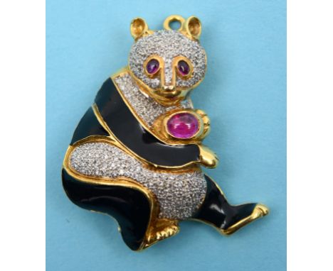 An 18ct yellow gold, ruby, diamond and enamel brooch, in the form of a panda bear  See front cover colour illustration