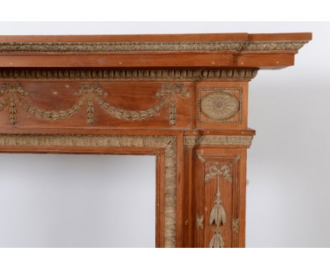 A George III style pine and gesso breakfront fire surround, in the Adams taste, 183 cm wide  See illustration