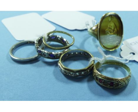 An 18ct gold seal ring, an 18ct white gold and platinum half hoop ring, and three other rings (5) Condition report Report by 