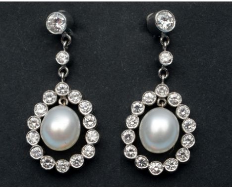 A pair of pearl and diamond drop earrings