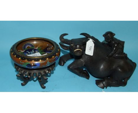 A Chinese cloisonné bowl, decorated dragons, on a carved hardwood base, 14 cm wide, and a carved hardwood model of a water bu