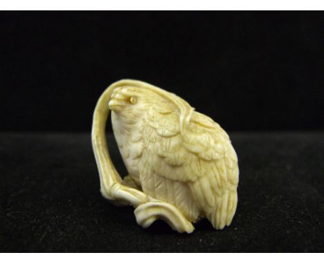 A Japanese carved ivory netsuke, in the form of a quail, with inlaid eyes, 3 cm high Condition report Report by GH

Generally