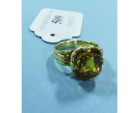 A yellow coloured metal and yellow stone ring