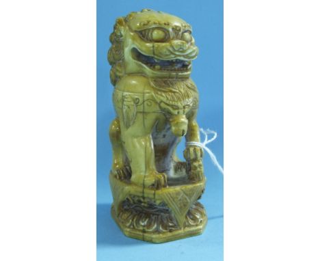 A Chinese carved ivory seal, in the form of a Dog of Fo (chipped), 10 cm high