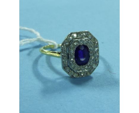 An 18ct gold, sapphire and diamond panel ring, the oval cut sapphire within two brilliant cut diamond halos Condition report 