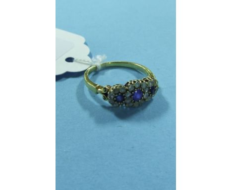 A sapphire and diamond cluster ring, in a white and yellow coloured metal mount Condition report Report by NG

Approx. ring s