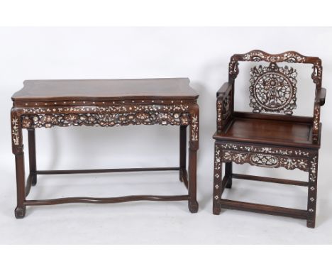 A pair of Chinese hardwood throne style armchairs, carved and pierced animals and foliage, and with mother of pearl inlaid de