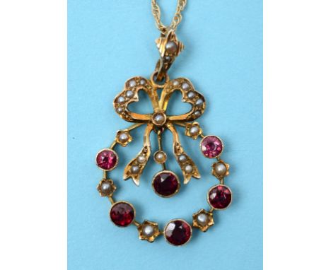 A 9ct gold, amethyst and seed pearl ribbon tie pendant, on a 9ct gold chain  See illustration Condition report Report by NG

