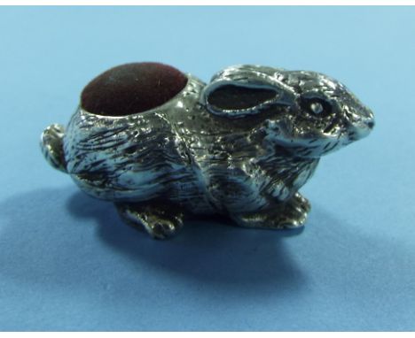 A novelty silver pin cushion, in the form of a rabbit