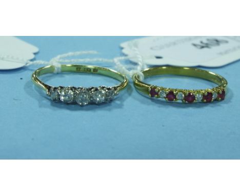 An 18ct gold and five stone diamond ring, and an 18ct gold, ruby and diamond ring (2)