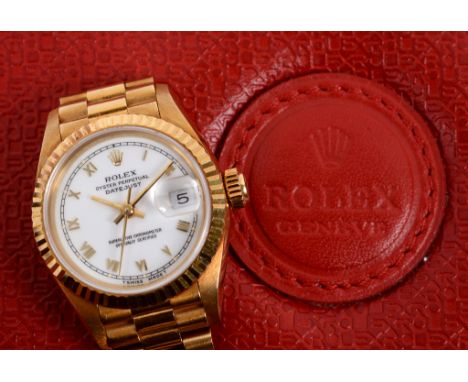 A lady's 18ct gold Rolex Oyster Perpetual Datejust wristwatch, the white dial having Roman numerals and date aperature, model