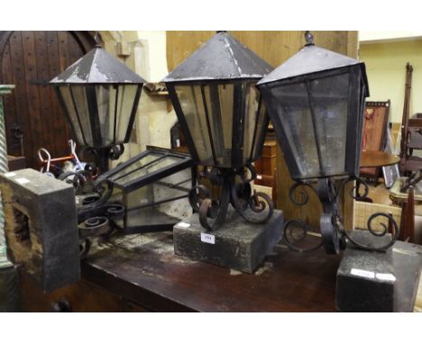 Four wrought iron lanterns, a similar lamp, a bird cage, a table vitrine, wicker trunk and other items (qty)