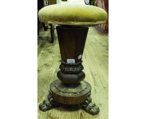 An early Victorian rosewood revolving piano stool