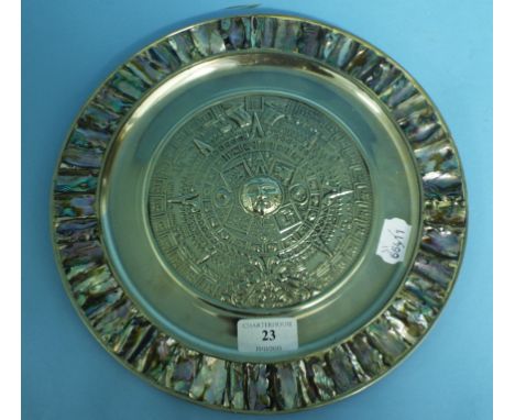 A Mexican silver coloured metal and mother of pearl charger, 27.5 cm diameter 