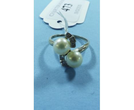 An 18ct gold, pearl and diamond crossover ring