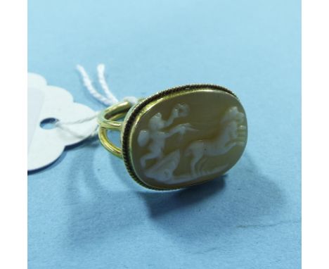 A yellow coloured metal and shell cameo ring, boxed