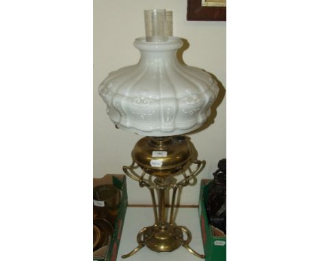 A Hinks brass table oil lamp, withan opaque glass shade, the base impressed Hinks 3634, 72 cm high