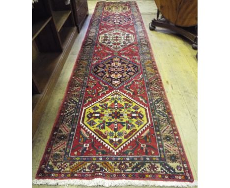 A Persian Heriz runner, 448 x 109 cm