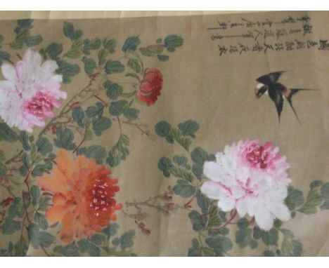 A Chinese painted scroll, decorated birds and flowers