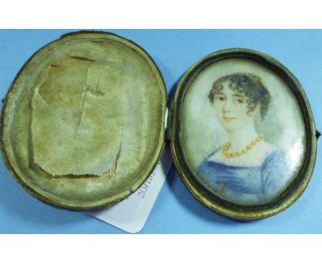 An oval bust portrait miniature, of a lady, cased, 6.5 x 5 cm