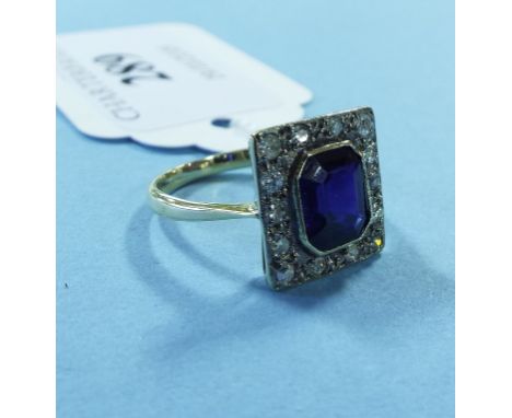 An 18ct gold, diamond and blue stone ring Condition report Report by NG

Blue stone - not amethyst
Approx. ring size L½
Appro