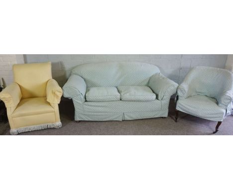 An Edwardian two seat Chesterfield sofa, with mahogany feet and brass castors, currently upholstered in light blue; together 