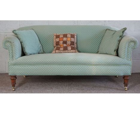 A small Victorian sofa, currently upholstered in jade green, with mahogany turned feet and brass castors, 168cm long