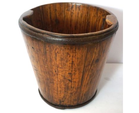 A vintage Chinese hardwood pail, probably 19th century, with coopered ‘barrel’ sides and iron hoops, the baes with partial wa