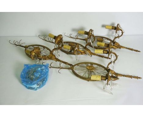 A set of four ormolu twin light wall lights, in the manner of Robert Adam, late 19th century, each with two sconces, now fitt