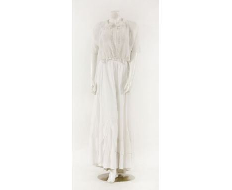 An Edwardian white cotton lawn day dress, with broderie anglaise embroidery and lace panel inserts, mid-length sleeves termin