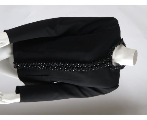 A Moschino 'Cheap and Chic' black jacket,with black plastic chain trim to neckline and front, together with a cream silk high
