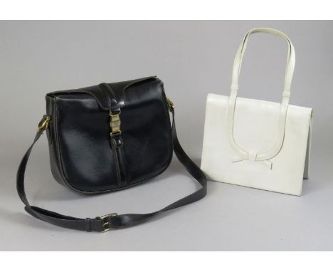 A Céline black leather ladies' handbag,with gilt clasp, anda vintage Christian Dior white leather handbag,with bow detail (2)