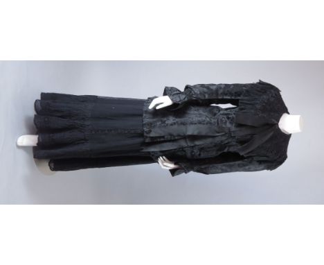 A late Victorian black silk jacket,woven with oriental cloud motif, large lace and chiffon pleated collar and stripe lining,a