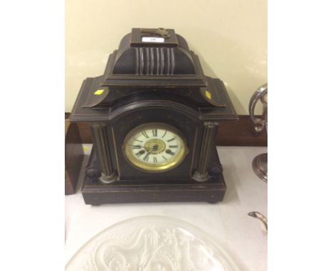 A late Victorian ebonised two hole mantel clock 