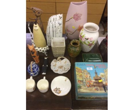 A floral pottery vase; various cat ornaments; a tin; two commemorative tea cups and saucers etc.