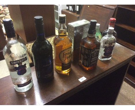 A bottle of Jack Daniels, Long John scotch whisky, Harveys Bristol Cream etc.