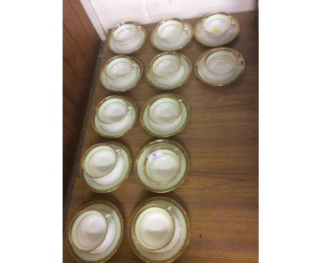 Twelve Limoges gilt decorated coffee cups and saucers 